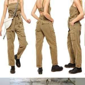 Free people M size, kakis colored  green/tan jumper. Back cut out.